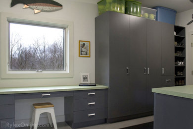 Mudroom - mid-sized contemporary mudroom idea in New York with beige walls