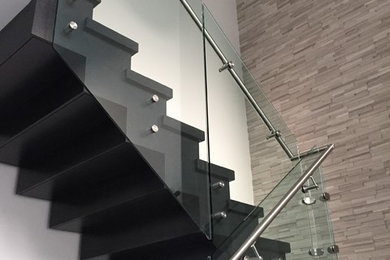 Mid-sized trendy painted u-shaped staircase photo in Calgary with painted risers
