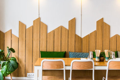 Photo of a mid-sized contemporary living room in Paris with multi-coloured walls and grey floor.