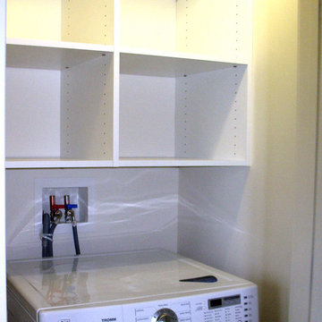Storage unit above washer and dryer