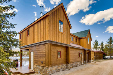Small rustic brown two-story wood exterior home idea in Denver