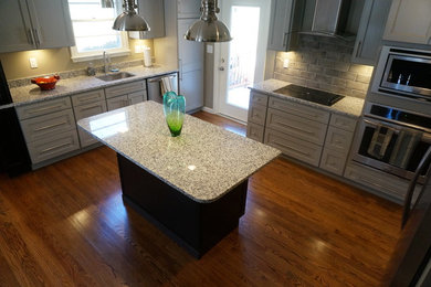 Mid-sized transitional u-shaped medium tone wood floor eat-in kitchen photo in Other with shaker cabinets, gray cabinets, granite countertops, gray backsplash, stainless steel appliances and an island