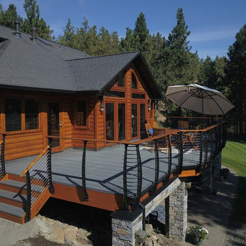Log Style Mountain Lake House With Stone Deck Pillars