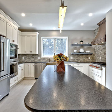 White Kitchen Remodel with Blue Island and Copper Accents