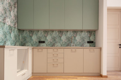 Kitchen - eclectic medium tone wood floor kitchen idea in Other