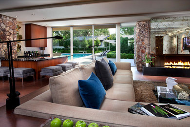 Inspiration for a large transitional open concept medium tone wood floor living room remodel in Salt Lake City with a bar, white walls, a ribbon fireplace and no tv