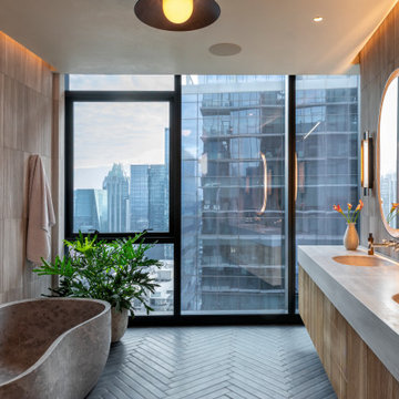Proper Vibes Penthouse Primary Bath with Carved Stone Tub