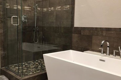 Photo of a bathroom in Dallas with grey cabinets, a freestanding tub, a corner shower, porcelain tile, grey walls, an undermount sink and quartzite benchtops.