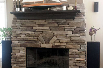 Living room - rustic carpeted and beige floor living room idea in Atlanta with beige walls, a standard fireplace and a stone fireplace