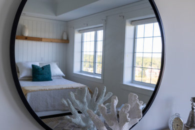Beach style tray ceiling and shiplap wall bedroom photo in Other