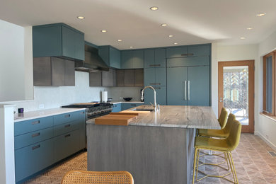 Example of a mid-sized trendy l-shaped ceramic tile and multicolored floor eat-in kitchen design in Other with an undermount sink, flat-panel cabinets, light wood cabinets, quartzite countertops, white backsplash, quartz backsplash, stainless steel appliances, an island and white countertops