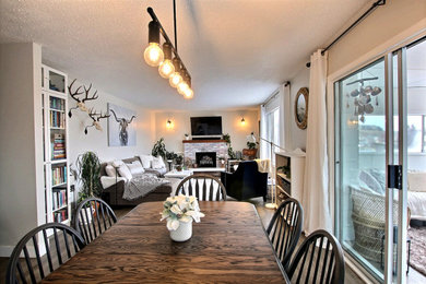 Inspiration for a mid-sized scandinavian vinyl floor great room remodel in Other with white walls