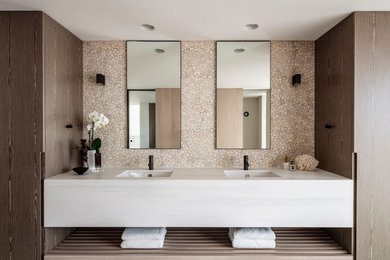Contemporary master bathroom in Sydney with white cabinets, beige tile, beige walls, ceramic floors, an undermount sink and marble benchtops.