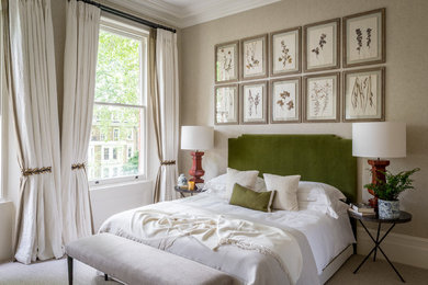 Photo of a traditional bedroom in London with beige walls, carpet and beige floor.