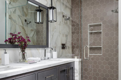 This is an example of a classic bathroom in San Francisco with shaker cabinets, medium wood cabinets, a double shower, grey tiles, stone tiles, grey walls, marble flooring, a submerged sink, marble worktops, white floors, a hinged door, white worktops, a wall niche, double sinks and a built in vanity unit.