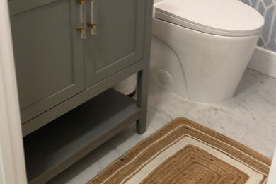 Small beach style 3/4 porcelain tile, single-sink and wallpaper bathroom photo in Other with shaker cabinets, gray cabinets, quartz countertops, white countertops and a freestanding vanity