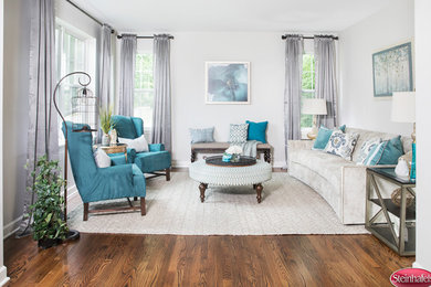 Living room - mid-sized transitional formal and enclosed medium tone wood floor and brown floor living room idea in Chicago with gray walls, no fireplace and no tv