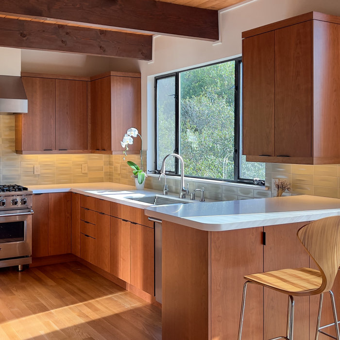 Eat-in kitchen - mid-sized modern medium tone wood floor and exposed beam eat-in kitchen idea in San Francisco with an undermount sink, flat-panel cabinets, medium tone wood cabinets, quartz counterto