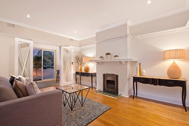 This is an example of a large midcentury formal enclosed living room in Sydney.