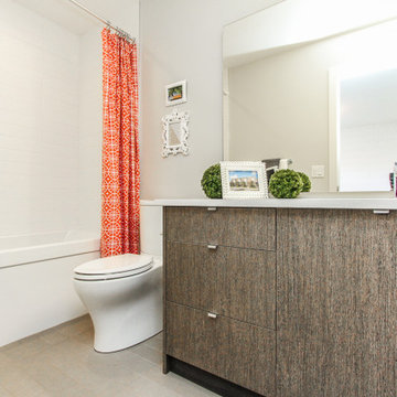 A bathroom with stylish wood-look in Marda Loop home