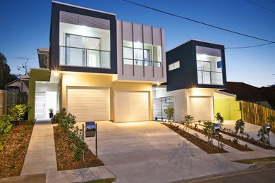 Inspiration for a modern terraced house in Brisbane with a flat roof and a metal roof.