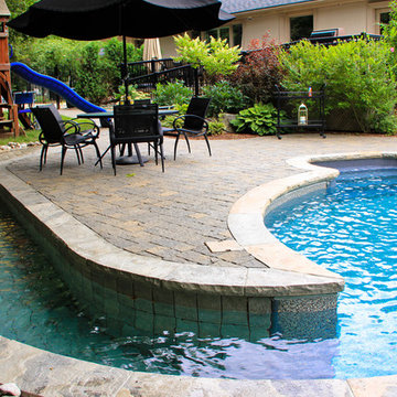Wheelchair Accessible Pool Renovation with Waterfall and Slide