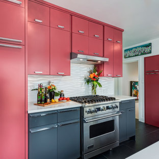 Pink Painted Kitchen Cabinets With Black Quartz Countertops