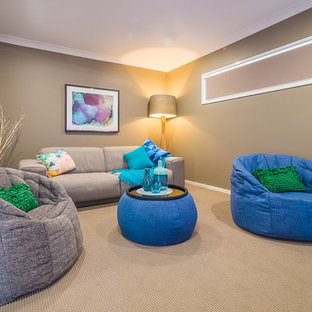 Small coastal enclosed carpeted home theater photo in Sunshine Coast with beige walls