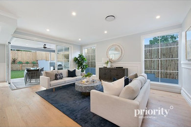 Photo of a mid-sized beach style formal open concept living room in Brisbane.