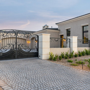 Gated Driveway Entry with Custom Iron Gate