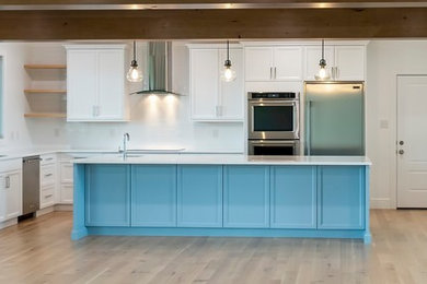 Large transitional eat-in kitchen photo in Other with an island and blue countertops