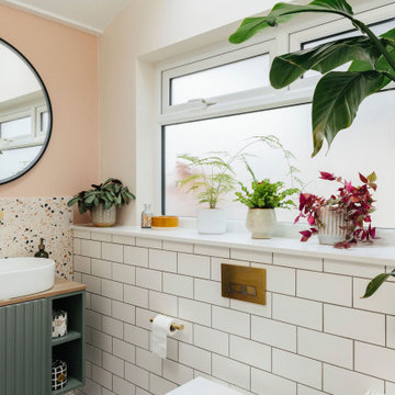 Pink & green bathroom with mix of tiles & patterns