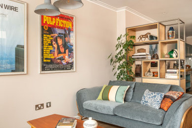 Design ideas for a medium sized contemporary living room in Kent with a home bar, white walls, ceramic flooring, beige floors and feature lighting.