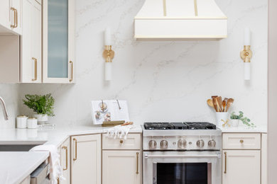 Open concept kitchen - mid-sized transitional u-shaped open concept kitchen idea in Dallas with a drop-in sink, shaker cabinets, beige cabinets, quartz countertops, multicolored backsplash, quartz backsplash, stainless steel appliances, a peninsula and multicolored countertops