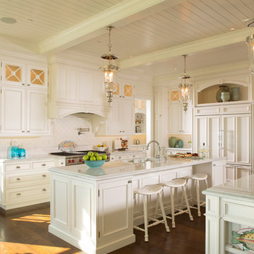 Classic white kitchen featuring double island.
