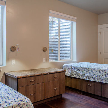 Basement Bedroom facing wells with large windows.