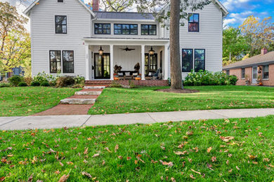 Inspiration for a cottage white concrete fiberboard gable roof remodel in Chicago