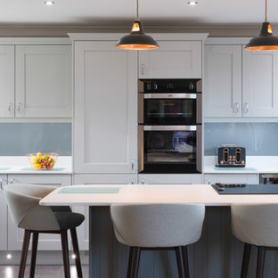Airy open plan grey and white shaker style kitchen