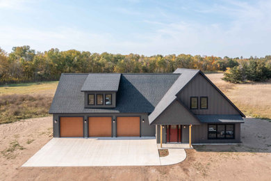 Mid-sized elegant exterior home photo with a shingle roof