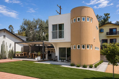 Example of a minimalist multicolored two-story mixed siding house exterior design in Los Angeles
