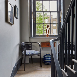 Photo of a traditional wood u-shaped staircase in London with wood risers.