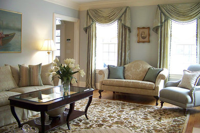 Example of a large classic formal and open concept light wood floor living room design in New York with blue walls, a standard fireplace and a stone fireplace