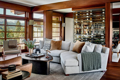 Example of a mid-century modern living room design in Denver