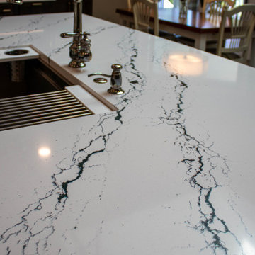 3 Finishes on Kitchen Cabinetry with Galley Workstation in Island and Wine Bar