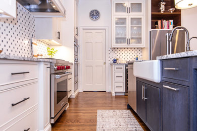 Eat-in kitchen - mid-sized contemporary l-shaped medium tone wood floor and brown floor eat-in kitchen idea in Charlotte with a farmhouse sink, beaded inset cabinets, white cabinets, quartzite countertops, white backsplash, stainless steel appliances, an island and gray countertops