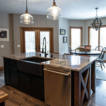 Reconfigured kitchen with new islands, countertops, backsplash