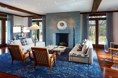 Large 1960s formal and open concept dark wood floor living room photo in New York with white walls, no tv, a standard fireplace and a stone fireplace