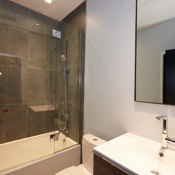 Sophisticated Bathroom with Dark Tile and Floating Vanity