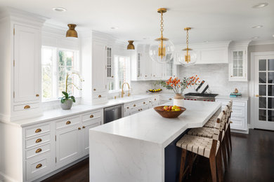 Example of a mid-sized transitional eat-in kitchen design in New York with shaker cabinets and quartz countertops