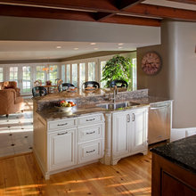 Kitchen overlooking dining room to view of lake